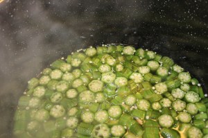 Pour hot fish stock over okra.