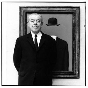 Photograph of Rene Magritte, in front of his painting The Pilgrim, as taken by Lothar Wolleh. Source: http://www.masters-of-photography.com/W/wolleh/wolleh_magritte_full.html.