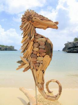 The seahorse, you can find him, deep in the warm waters of the Caribbean sea moving with the flow of the tide. When the sunlight shines on him, he looks strong and confident. He has drifted with the current of the oceans and settled down on this coral reef as his command post. To reach his destiny he followed his heart and now he will stay here for a while to fill up his heart with happiness, precious memories and new dreams... - nini by Nini"s driftwoodart
