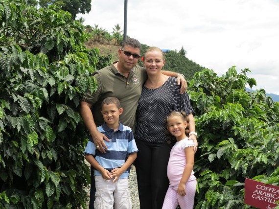 Cedric and Nanda Sprock and their 2 adorable kids surrounded by Coffee Beans in Colombia. 